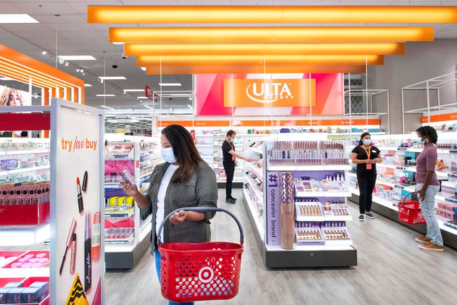 This photo provided by Target shows the Ultra Beauty inside Target department store in Edina, Minn., on Aug. 14, 2021.  Americans are splurging on beauty as they tighten their budgets elsewhere. According to market research company IRI, sales of eye, face and lip makeup has gone up across stores. It comes as major retailers slashed their financial outlooks for the year after seeing shoppers pull back on many discretionary items in the latest quarter. (Target via AP)