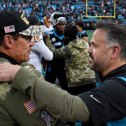 Could former Carolina coach Ron Rivera (left), now
