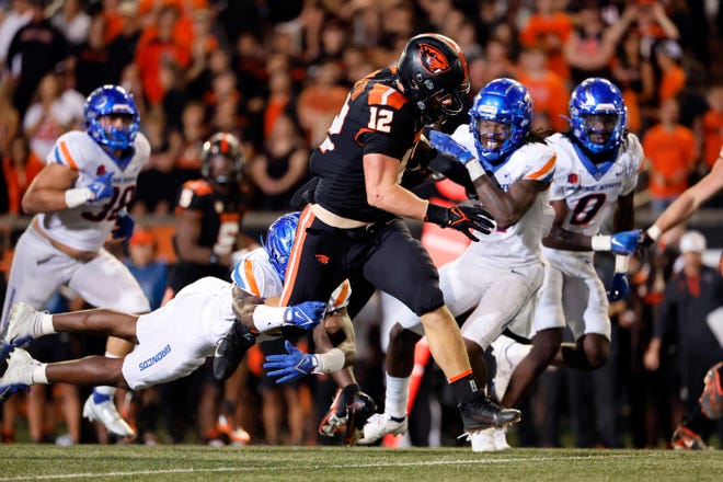 Oregon State Beavers inside linebacker Jack Colletto (12) avoids the tackle of Boise State Broncos cornerback Tyric LeBeauf (22) during the second half of the game at Reser Stadium on Sept. 3 in Corvallis.