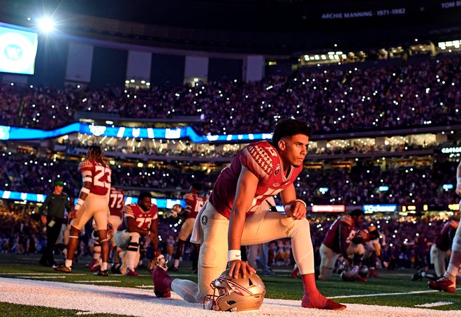 Sep 4, 2022; New Orleans, Louisiana, USA; Florida State Seminoles quarterback Jordan Travis (13) stretches before the start of the game against the Louisiana State Tigers at Caesars Superdome. Mandatory Credit: Melina Myers-USA TODAY Sports