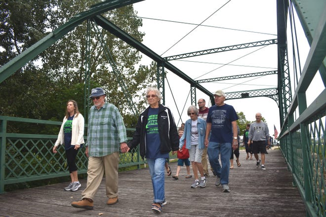 People make their way across Morenci's Silver Creek Bridge during the city's 28th annual Labor Day bridge walk Monday.