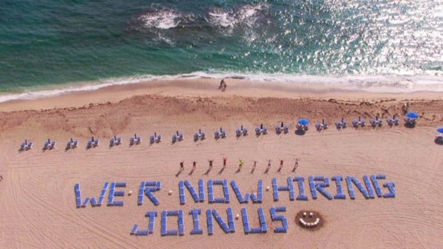 Palm Beach Marriott Singer Island came up with an innovative way to find workers for the upcoming winter tourist season. Hotel officials spelled out a "Help Wanted" sign with beach chairs. Photo provided by Palm Beach Marriott Singer Island.