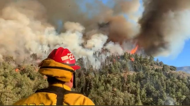 Rain associated with weakening Hurricane Kay in the Pacific may help firefighters battling the Radford Fire, which began on Labor Day south of Big Bear Lake.
