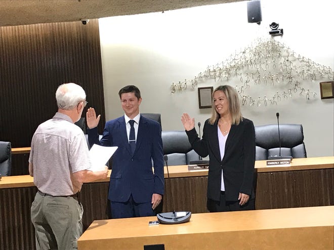 Safety Service Director Dave Remy swears in Joshua Taylor and Staci Hankins Tuesday as the newest members of the Mansfield Police Department.