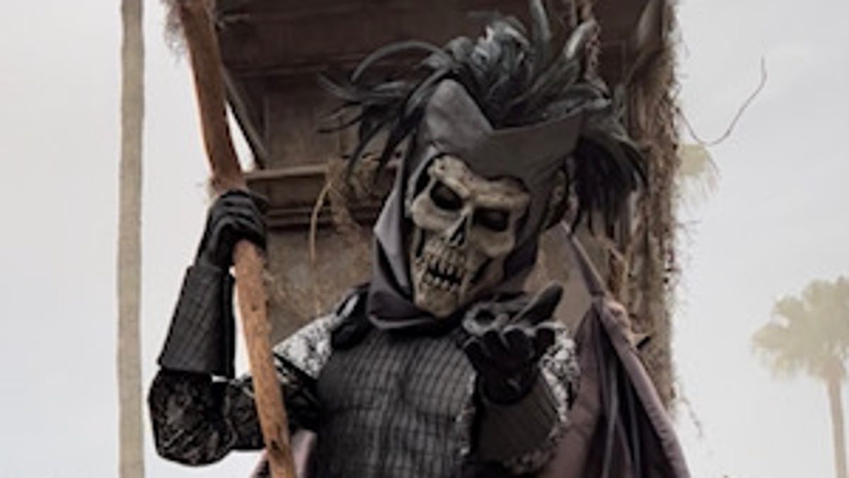 A scareactor greets guests at Universal Orlando's Halloween Horror Nights 31.