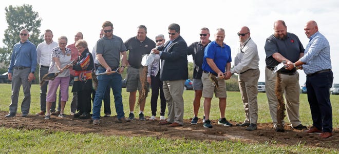 People pose for a photo during the groundbreaking of the new Public Works Campus, Wednesday, Sept. 7, 2022, in Lafayette, Ind. 
