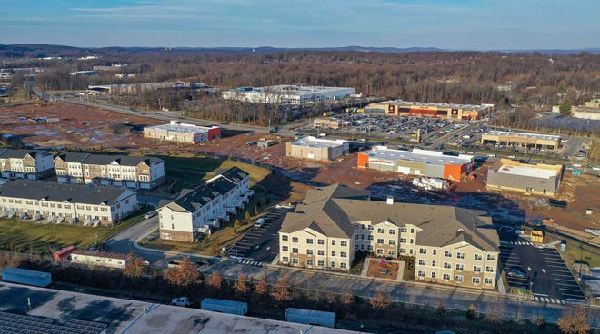 An overhead view of redevelopment along West Hanover Avenue on the border of Hanover (top of image) and Morris Townships. You can see Loews on the upper left, Morris Marketplace in the center, and townhomes under construction below.