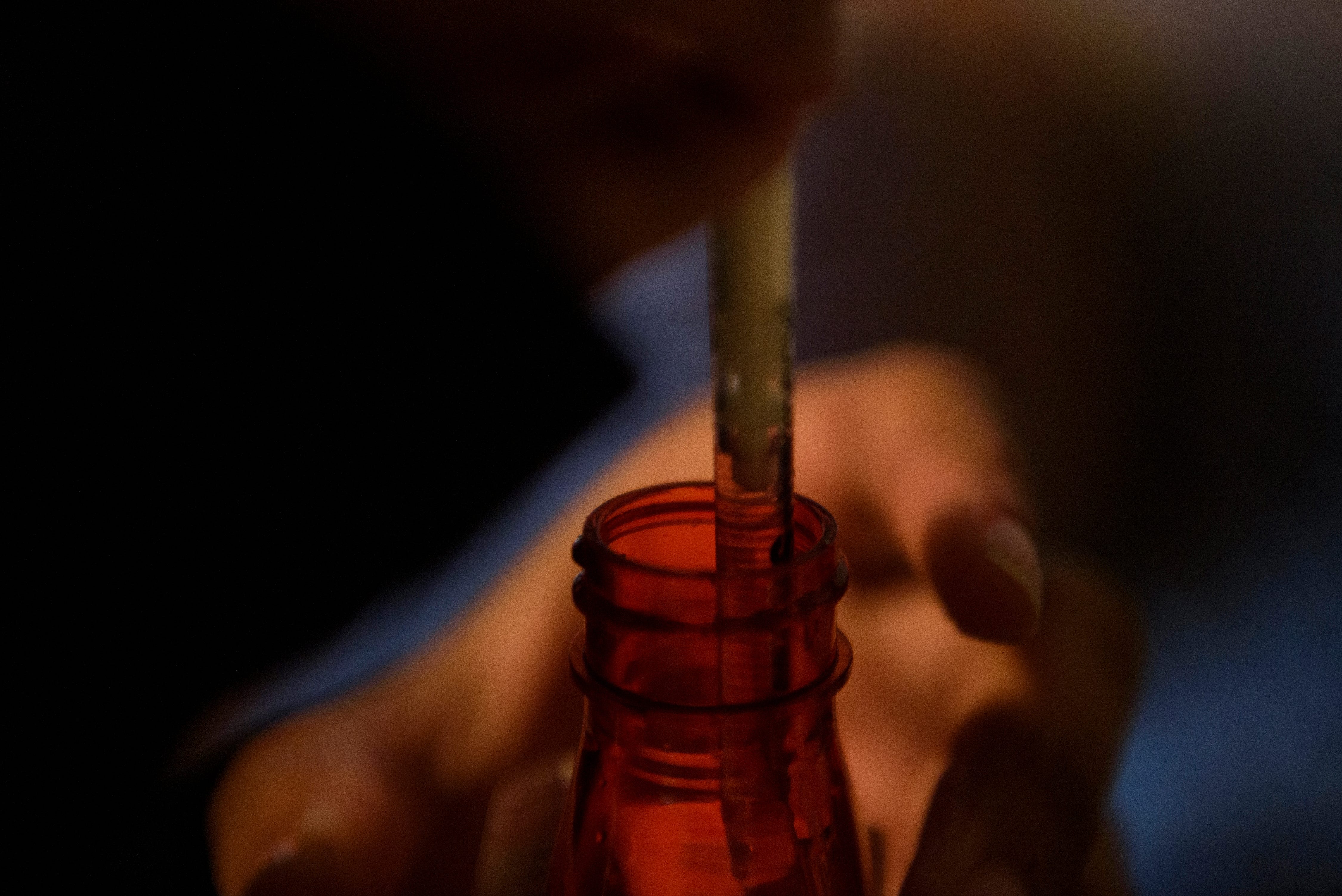 Liza Fisher draws medicine into a syringe at her home in Houston on Sept. 5, 2022.