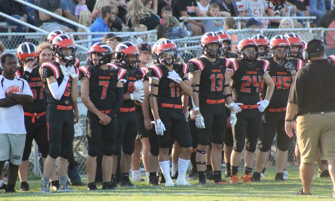 The Cheboygan varsity football team looks on during its opening night matchup with Lake City on Aug. 26. Cheboygan's back on the road again this week as it travels to face the Sault Blue Devils in a league contest on Friday at 7 p.m.