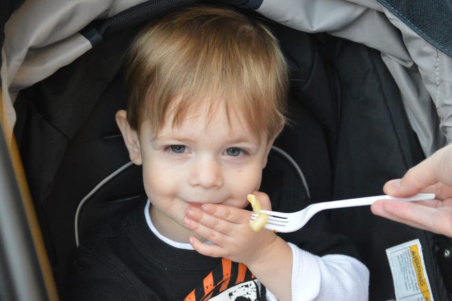 Nicholas Tarara of Fitchburg would rather not eat the macaroni and cheese being offered to him at the 2019 Leominster Food Truck Festival.