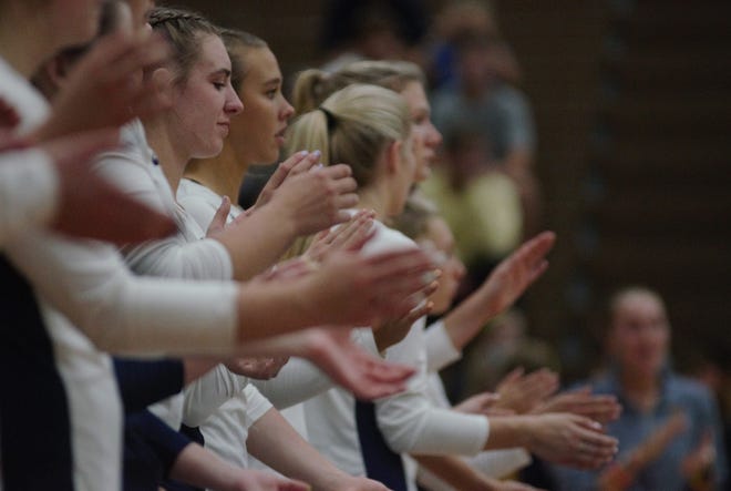 The Gaylord volleyball team claps for their opponents prior to a volleyball matchup between Gaylord and Petoskey on Wednesday, September 7.