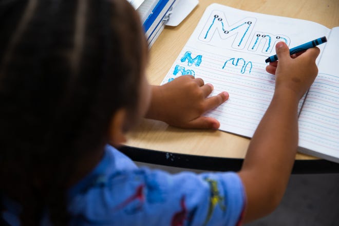 A pre-kindergarten student writes the letter "M" at West Oso ISD's John F. Kennedy Elementary on Thursday, Sept. 8, 2022, in Corpus Christi, Texas.