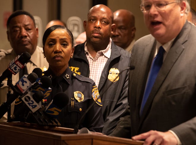 Memphis Police Chief Cerelyn "CJ" Davis listens as Memphis Mayor Jim Strickland speaks during a press conference early Thursday, Sept. 8, 2022, after 19-year-old Ezekiel Dejuan Kelly is alleged by MPD to be responsible for several shootings in Memphis. The shootings on Wednesday ended with seven people shot, at least four of the seven dead. 