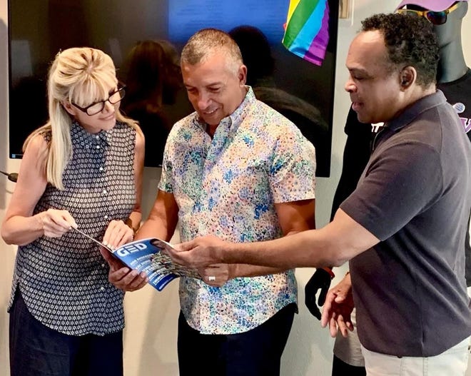 Sandie Newton meets with Tim Vincent, Brothers of the Desert board president, and Andre Carthen, Brothers of the Desert board member.