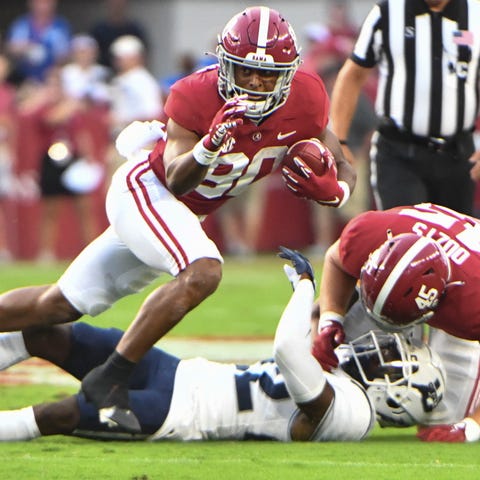 Alabama wide receiver Kobe Prentice (80) runs the 