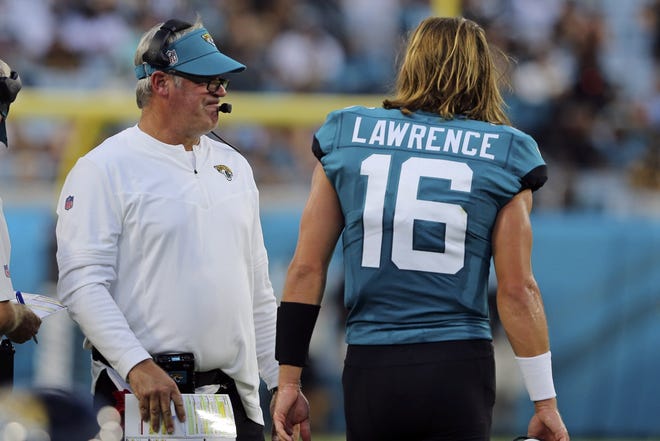 With a former NFL quarterback and Super Bowl-winning coach in Doug Pederson (L) at his side, Jaguars' quarterback Trevor Lawrence (16) has a surrounding cast to make giant strides in his second year.