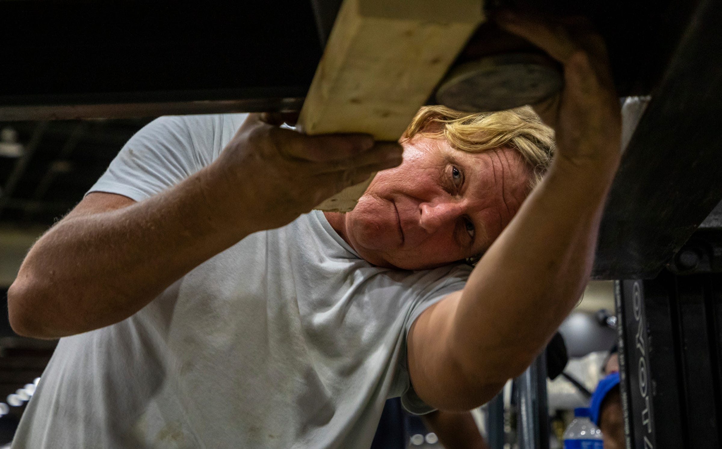 Ken Lopata, 57, ironworker Local 25, levels a metal platform for the North American International Auto Show inside the Huntington Place convention center in Detroit on Friday, Sept. 2, 2022.