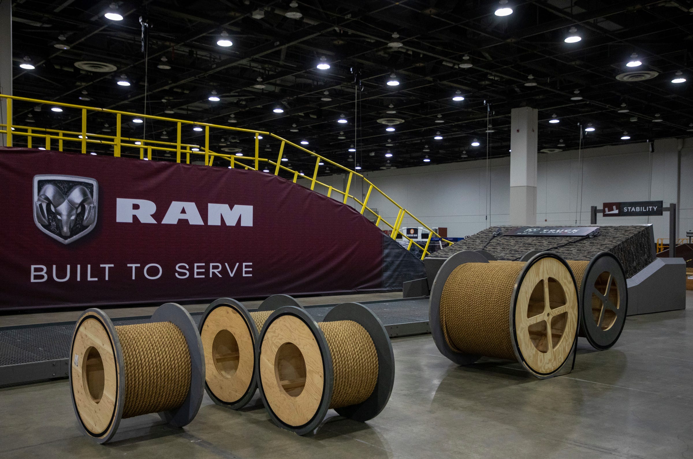 Large twine ropes sit in front of the Ram experience torque wall and ramp for the North American International Auto Show preparations in Detroit on Wednesday, Sept. 7, 2022.