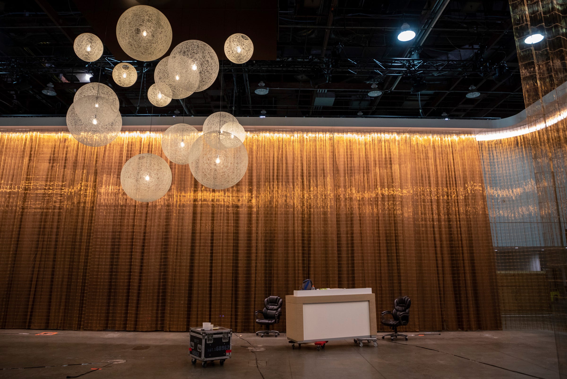 Hanging lights make up the Lincoln display area as workers prepare for the North American International Auto Show inside the Huntington Place convention center in Detroit Wednesday, Sept. 7, 2022.