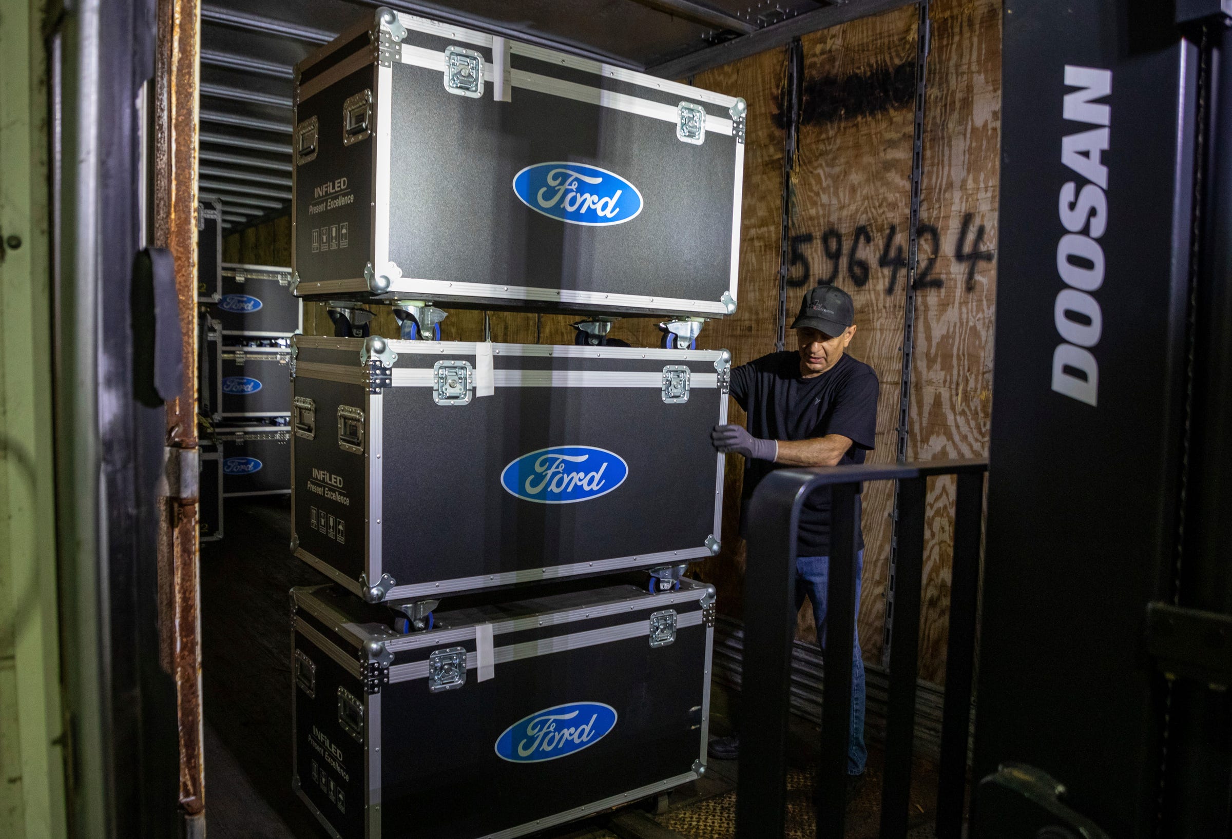 David DeMario, 67, helps unload large boxes belonging to Ford Motor Co. for the setup of the North American International Auto Show inside the Huntington Place convention center in Detroit on Friday, Sept. 2, 2022.
