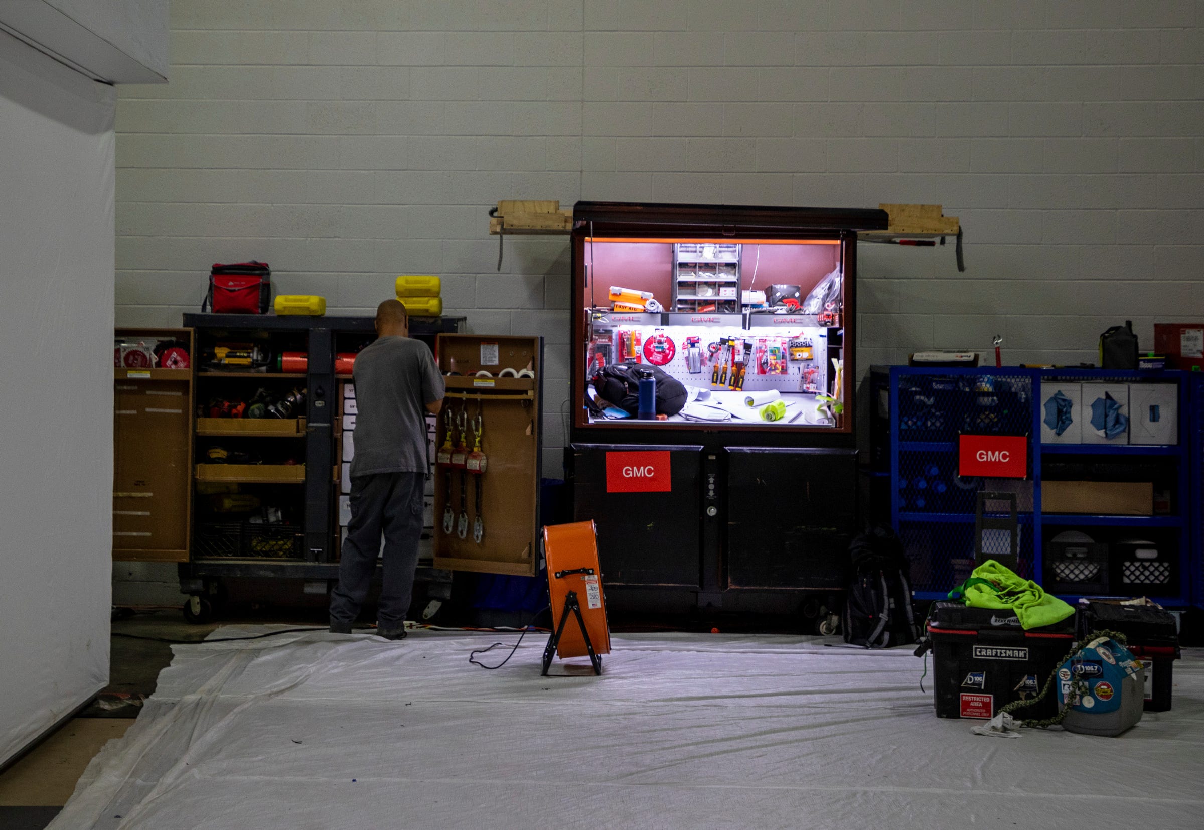 An employee looks through a toolbox inside the Huntington Place convention center in Detroit on Wednesday, Sept. 7, 2022.