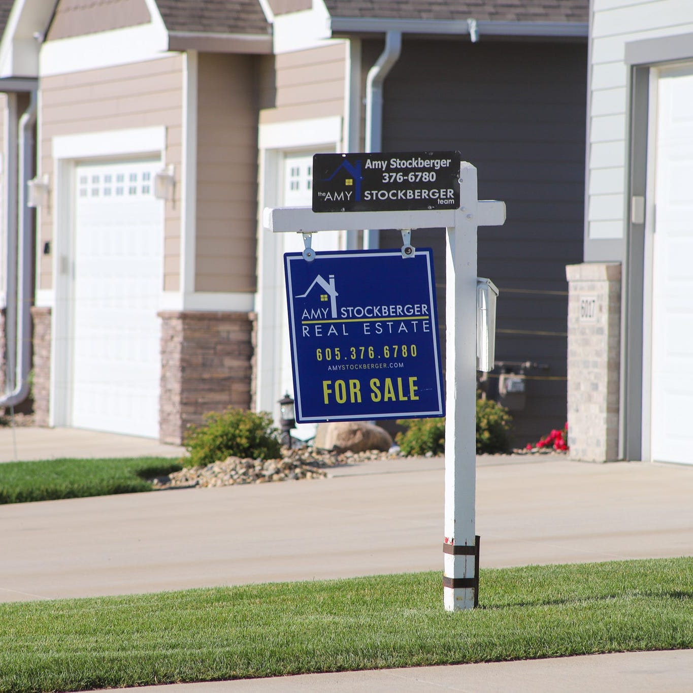A house for sale in Sioux Falls, South Dakota, in July is shown. Across the United States, communities reported fewer house sales than they had a year ago as rising interest rates and high prices make it harder to afford a home.