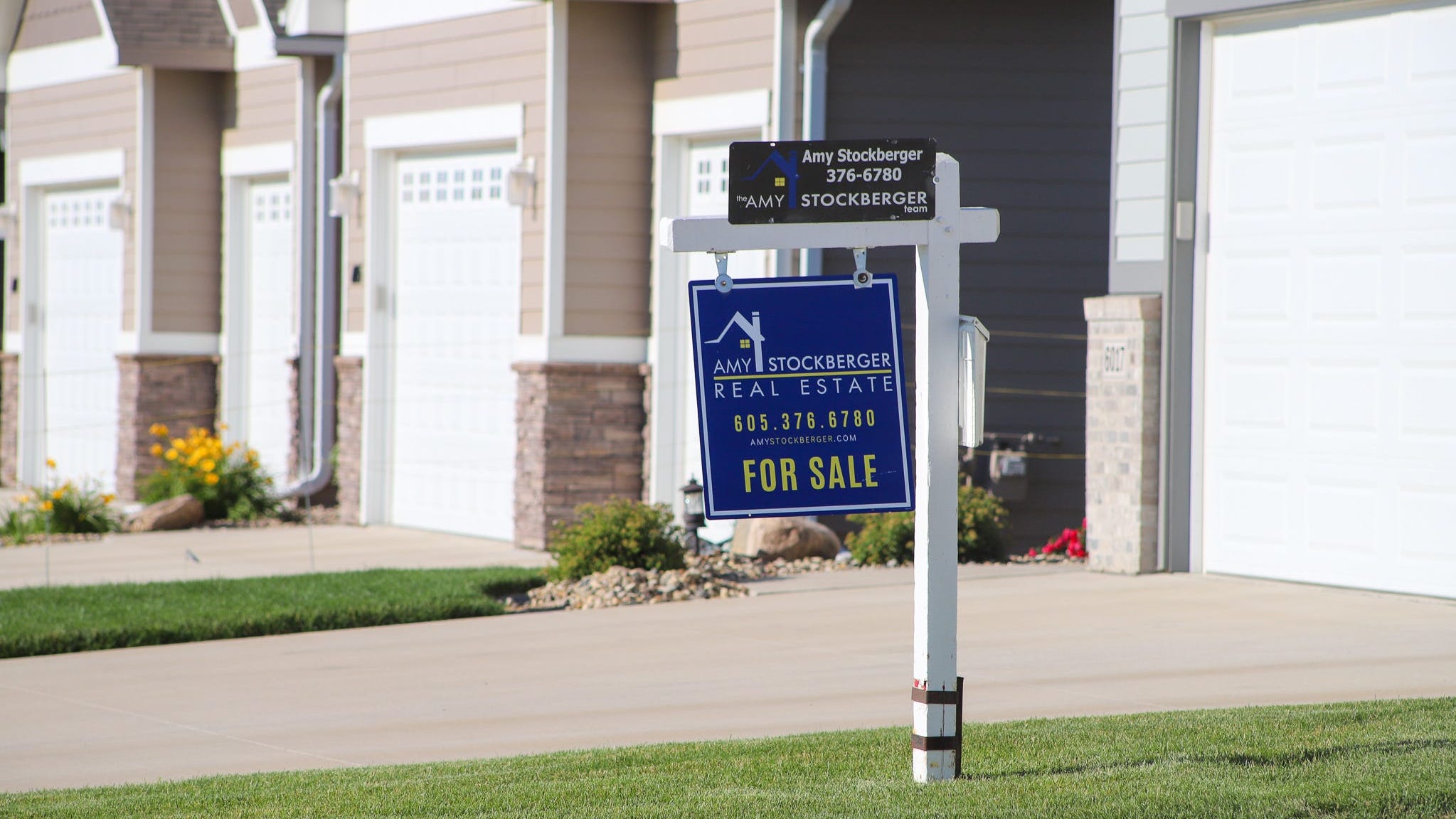 A house for sale in Sioux Falls, South Dakota, in July is shown. Across the United States, communities reported fewer house sales than they had a year ago as rising interest rates and high prices make it harder to afford a home.