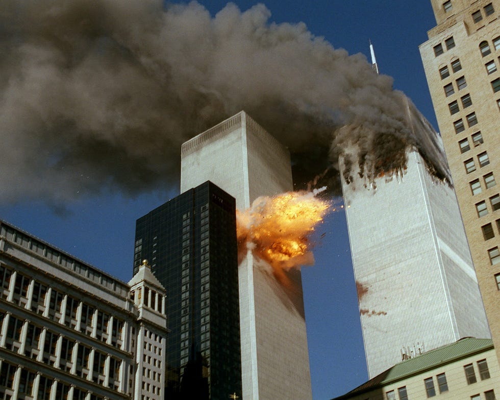 In this Sept. 11, 2001 file photo, United Airlines Flight 175 collides into the south tower of the World Trade Center in New York as smoke billows from the north tower.