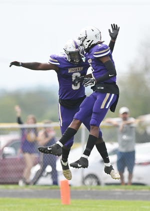 Western Beaver's Dorian McGhee (9) and Mikey Crawford (1) celebrate McGhee's touchdown during Saturday's game at Rich Niedbala Football Field.