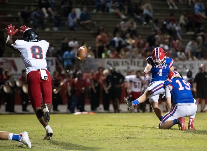 Riece Griffith (4) adds the extra point to give the Patriots a 14-7 lead during the West Florida vs Pace football game at Pace High School on Friday, Sept. 9, 2022.
