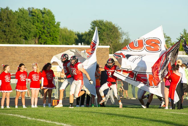 Bucyrus bursts through a banner ahead of its Week 4 clash with Colonel Crawford.