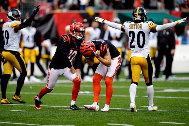 Cincinnati Bengals place kicker Evan McPherson (2) reacts after missing a field goal during the overtime period of a Week 1 NFL football game against the Pittsburgh Steelers, Sunday, Sept. 11, 2022, Paycor Stadium in Cincinnati. Mandatory Credit: Sam Greene-USA TODAY Sports