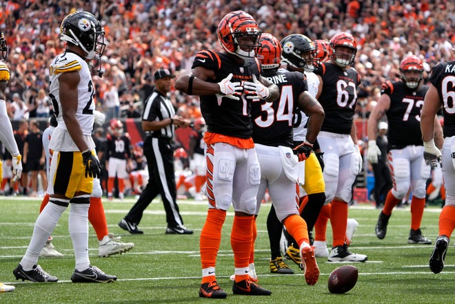 Cincinnati Bengals wide receiver Ja'Marr Chase (1) reacts after completing a catch during the third quarter of a Week 1 NFL football game against the Pittsburgh Steelers, Sunday, Sept. 11, 2022, Paycor Stadium in Cincinnati. Mandatory Credit: Cara Owsley-USA TODAY Sports