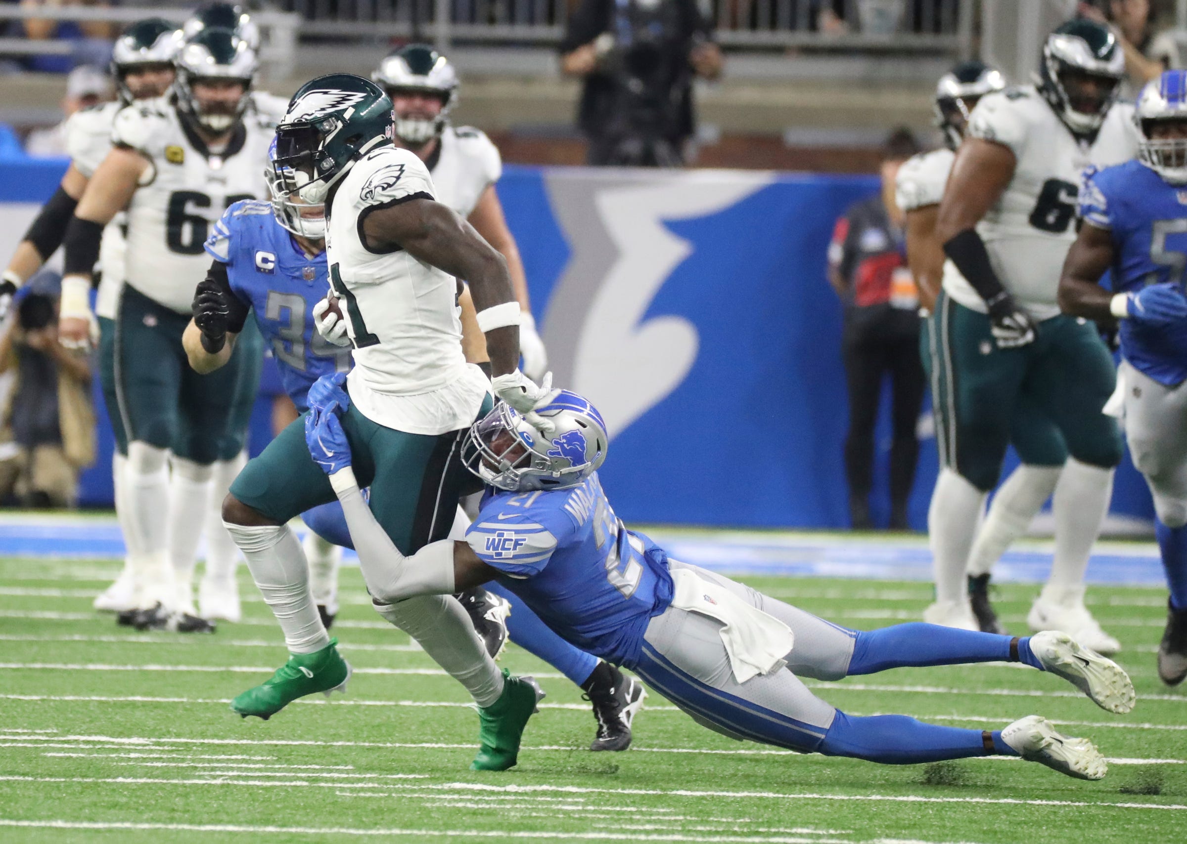 Detroit Lions safety Tracy Walker III (21) tackles Philadelphia Eagles receiver AJ Brown during the first half at Ford Field, Sept. 11, 2022.