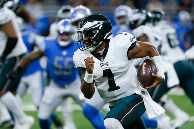 Philadelphia Eagles quarterback Jalen Hurts (1) runs the ball against the Detroit Lions in the first half of an NFL football game in Detroit, Sunday, Sept. 11, 2022.