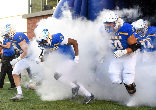 South Dakota State players run onto the field before their game against UC-Davis on Saturday, September 10, 2022, at Dana J. Dykhouse Stadium in Brookings.