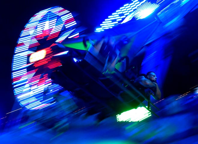 Lights are blurred in this slow exposure as visitors experience the Cliff Hanger ride at the West Texas Fair & Rodeo Thursday.