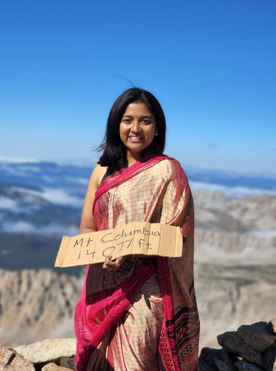 Theresa Juliues Caesar stands on the summit of Mount Columbia in Colorado on Aug. 27, 2022.