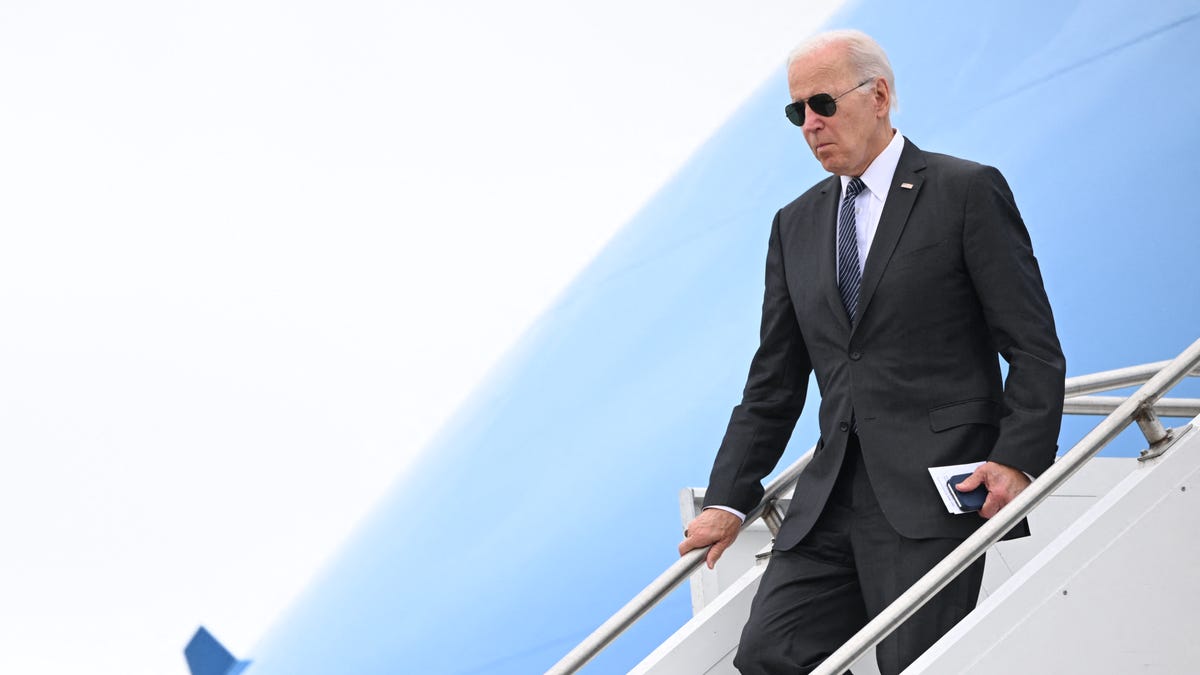 US President Joe Biden disembarks Air Force One at Boston Logan International Airport in Boston, Massachussetts, on September 12, 2022. - Biden is travelling to Boston to deliver remarks on his Bipartisan Infrastructure Law, as well as the Cancer Moonshot.