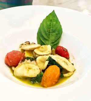 Trevini's new Orecchiette with rapini, octopus, garlic olive oil and basil pesto.