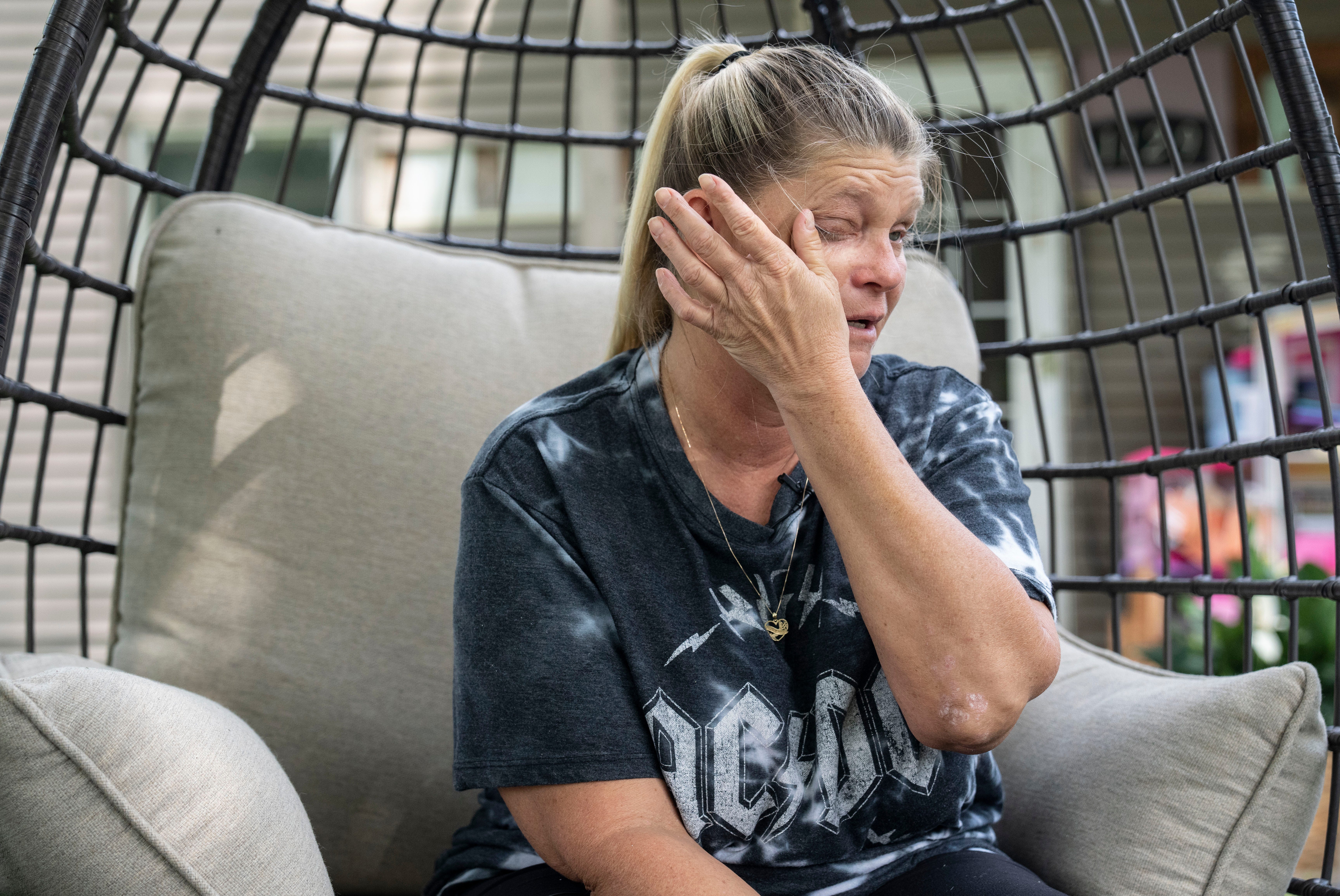 Tina Latham wipes tears from her eyes while talking about her daughter, Courtney Smith, who was found dead after a night partying with friends at two bars in Indianapolis.