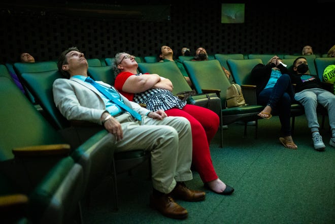 Dale McIntosh, left, and Kerry McIntosh watch a show at the Robert Wollman Planetarium at King High School in Corpus Christi, Texas, on Tuesday, Sept. 13, 2022.