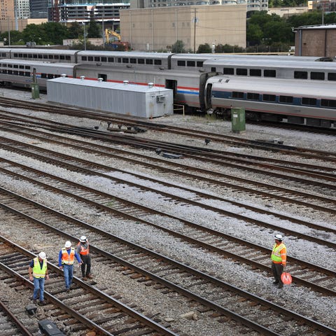 Workers service the tracks at the Metra/BNSF railr