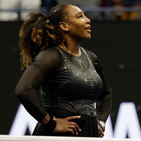 Serena Williams stands on the court following her 