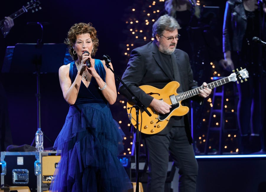NASHVILLE, TENNESSEE - DECEMBER 13: Amy Grant and Vince Gill perform at the Ryman Auditorium on December 13, 2021 in Nashville, Tennessee. (Photo by Jason Kempin/Getty Images)