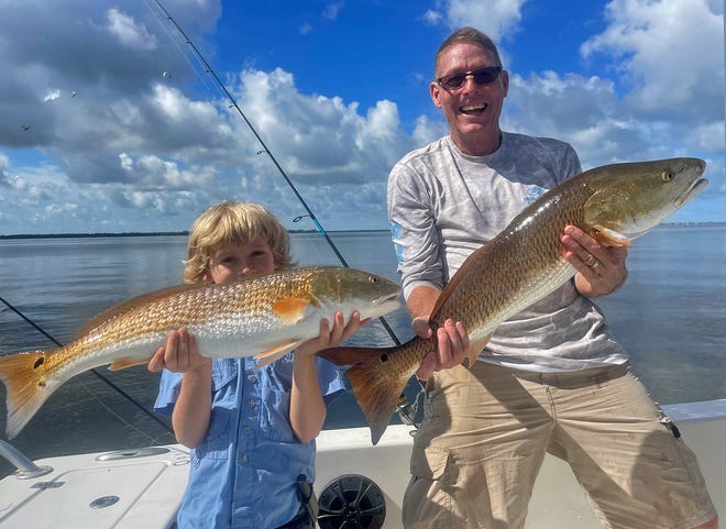 Jessie Jacques, 8, and his father Tom Jacques of Sarasota caught these over slot size redfish on live pinfish in lower Tampa Bay while fishing with Capt. John Gunter this week.