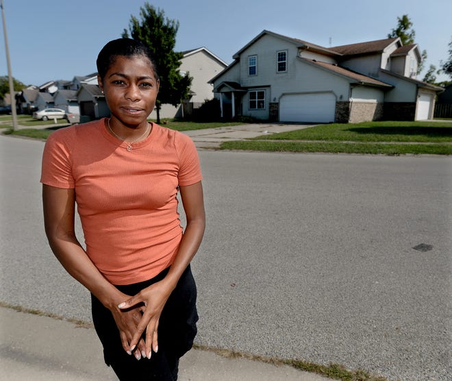 Neighbor Sharika Griffin stands outside her home in the 140 block of Genoa Drive Wednesday Sept 14, 2022. Griffin lives across the street from Mark J. Crites, who faces arson charges and separately, two counts of murder.