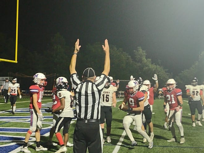 The referee signals touchdown, as Madison brought the score to 21-14 on this Caden Hilemon rushing touchdown in the fourth quarter. The Patriots would lose by that score to East Rutherford Sept. 9.