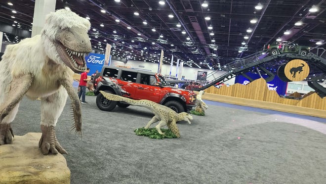 Detroit Auto Show 2022: A different show floor with dinosaurs, cars, and rides.