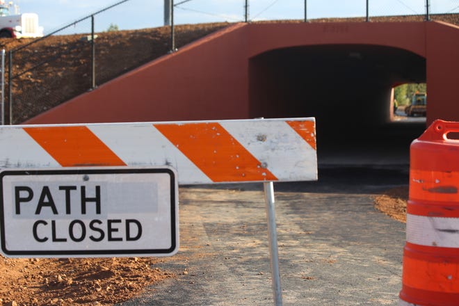 Signs block the path where a new pedestrian tunnel is set to open alongside Interstate 15 in St. George. City transportation managers say the new tunnel will make it safer to pedestrians and cyclists to cross the busy roadway and relieve some of the congestion on roads like Bluff Street and Black Ridge Road.